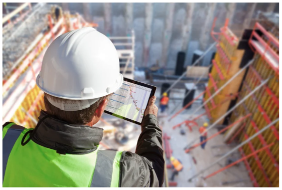 Worker looking at the project details on a tablet.